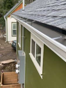 Picture of a house with a repaired gutter installation.